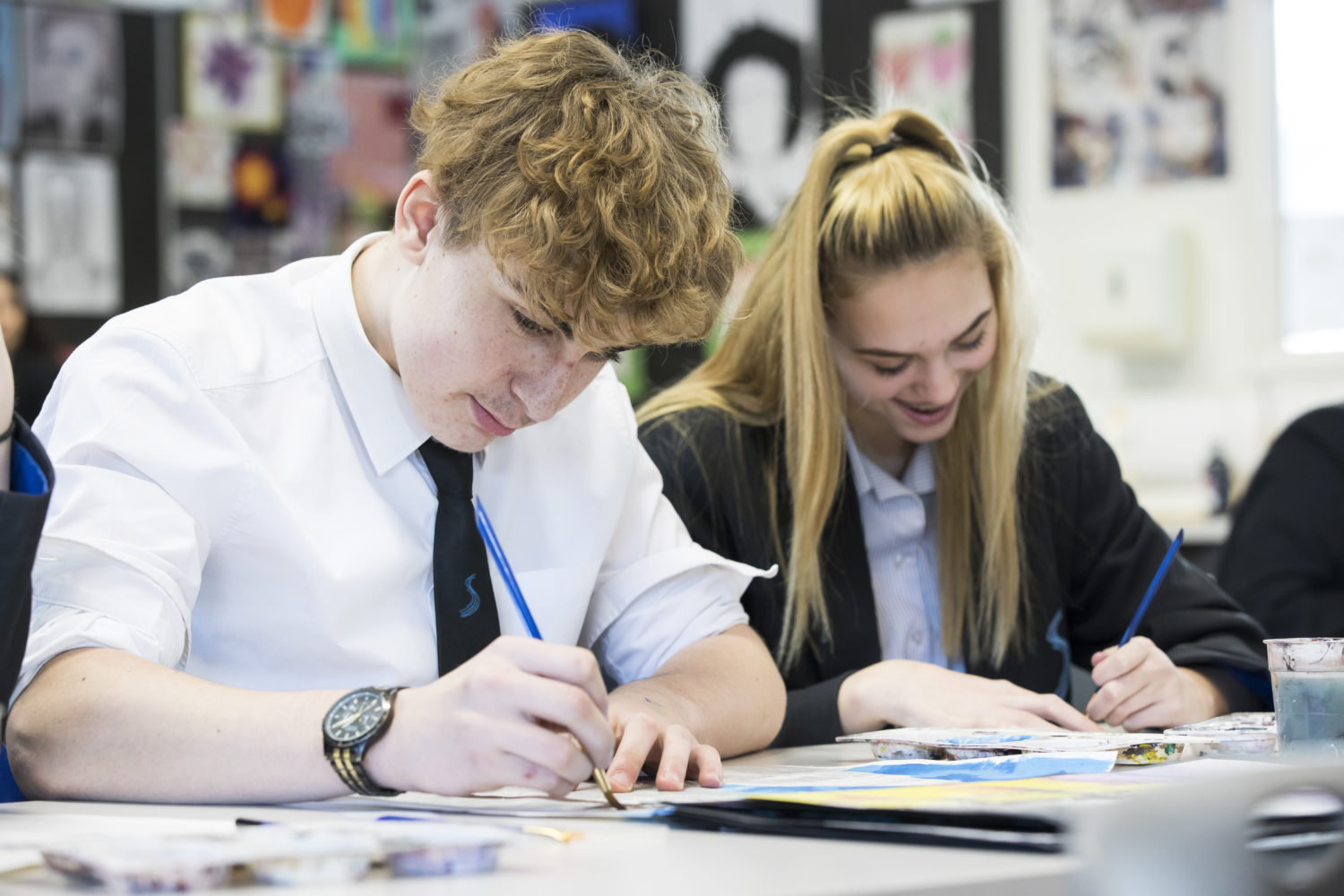 Two Strood Academy students are pictured painting during an Art lesson.