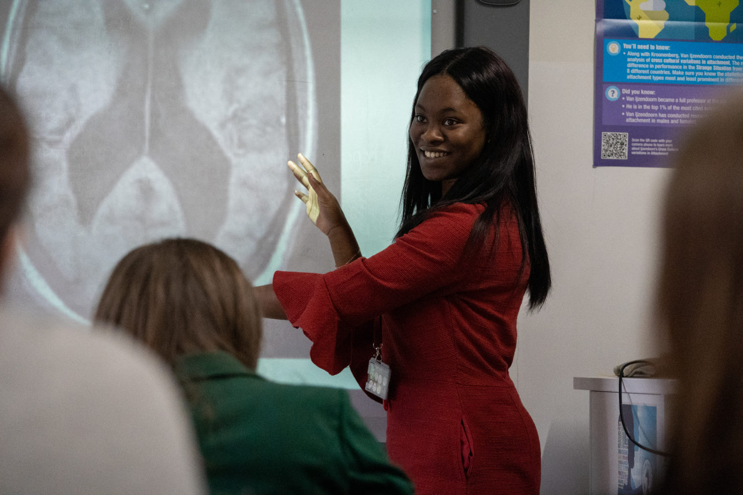 A student giving a presentation on the human brain to a class of people