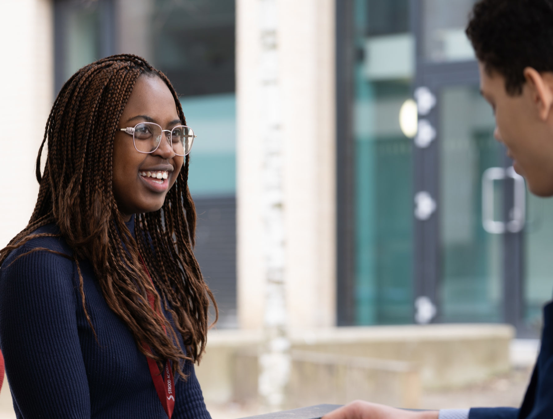 Close up of two students laughing