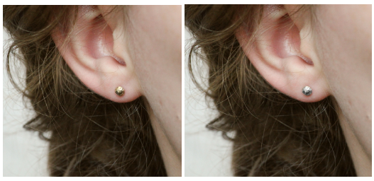 A close up of a girl's ear with a gold earring stud, and another with a silver earring stud